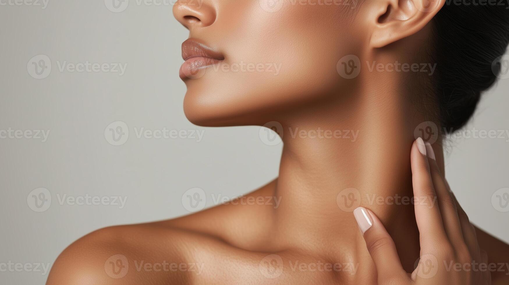 Captivating profile of a woman showcasing elegance and natural beauty in a softly lit setting photo