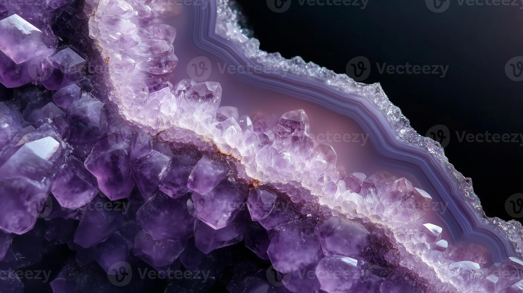 Purple amethyst crystal formation showcasing intricate patterns and textures under soft lighting photo
