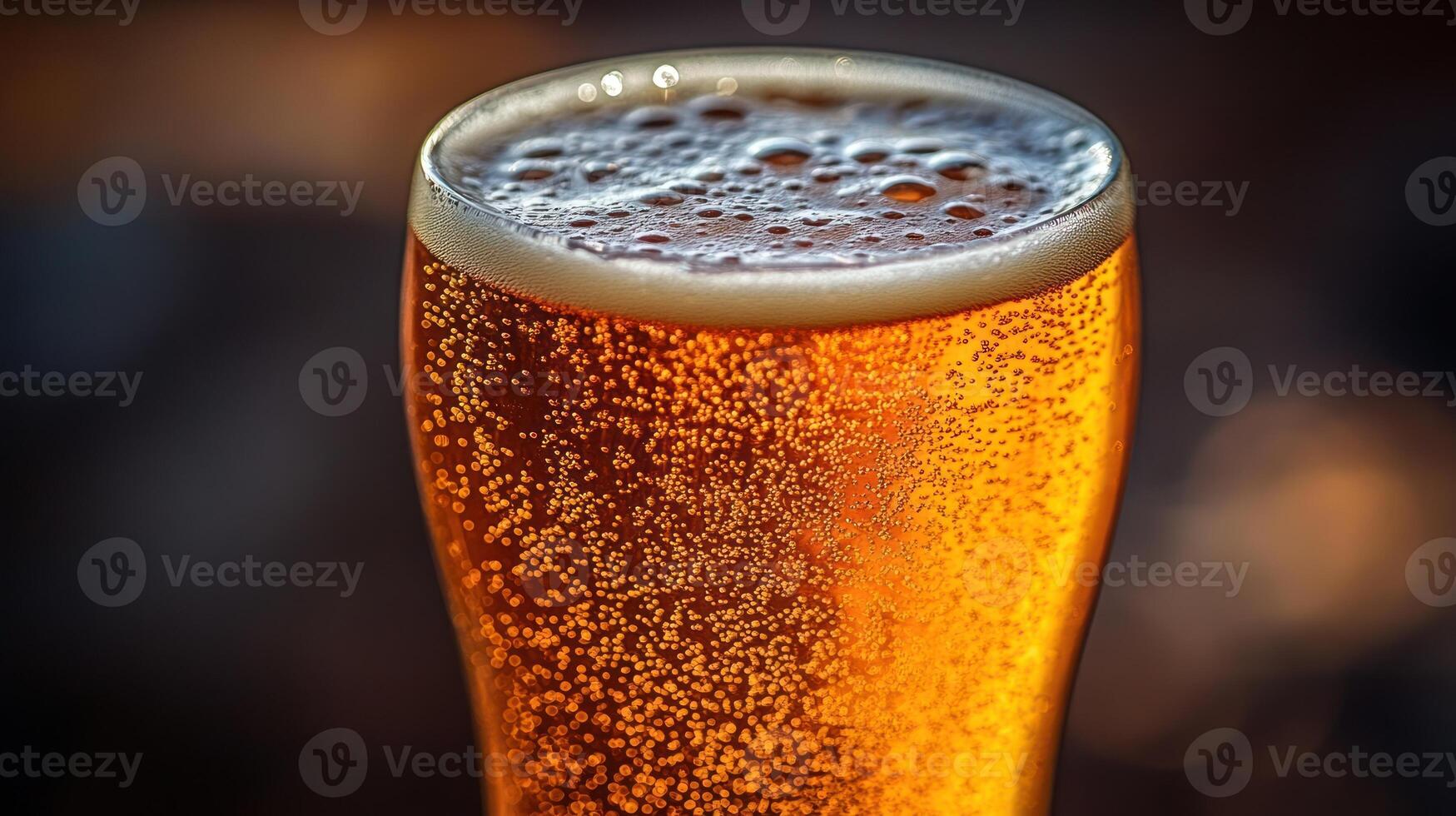 A glass filled with golden beverage sparkles under sunlight, capturing the essence of relaxation photo
