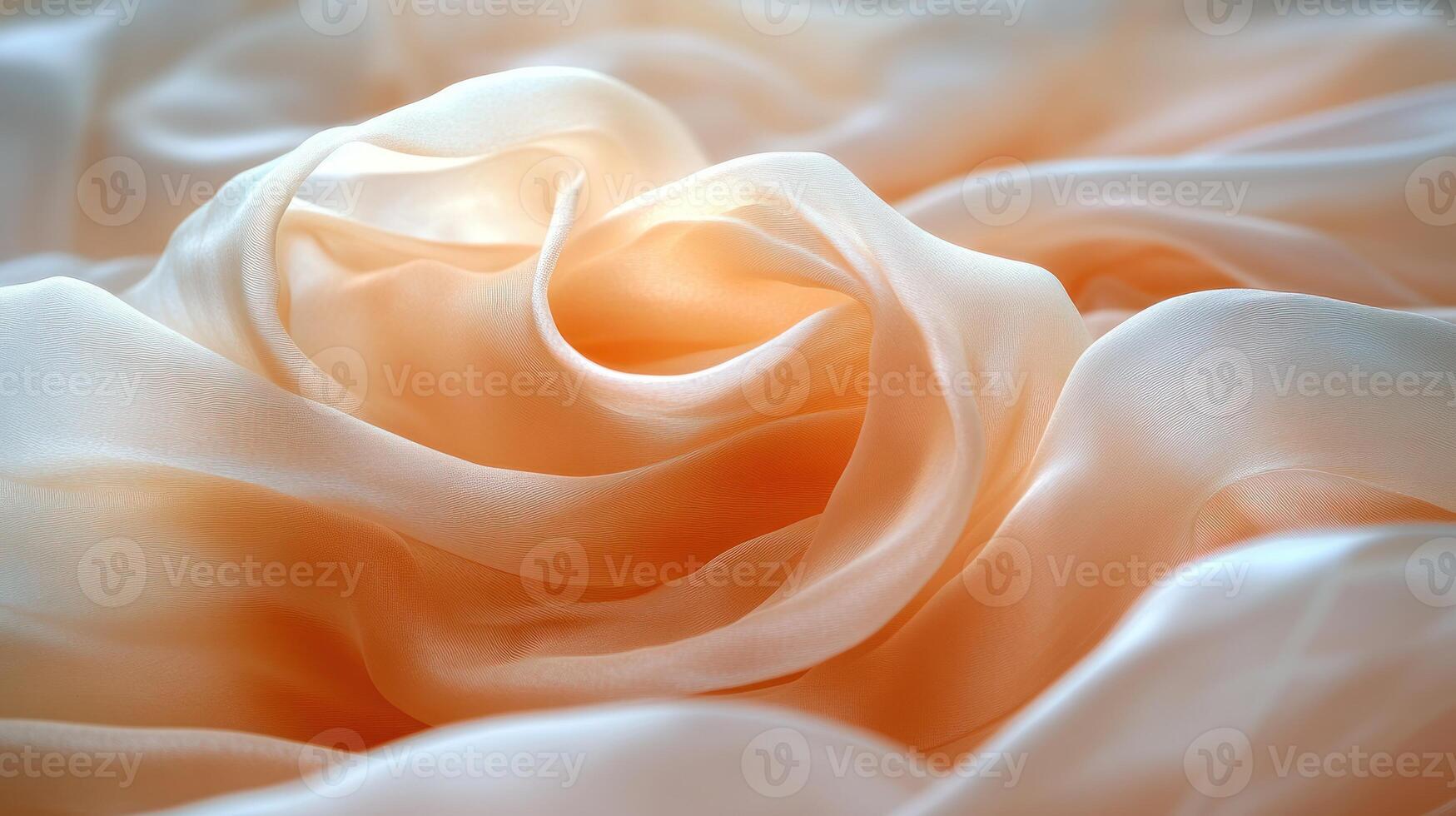 Silk fabric swirls together in soft peach tones, creating a flowing and graceful texture photo