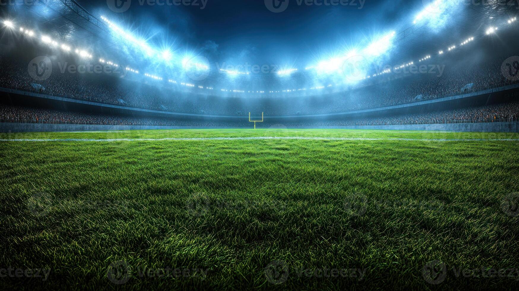 Empty football field with bright stadium lights illuminating the green grass under a night sky photo