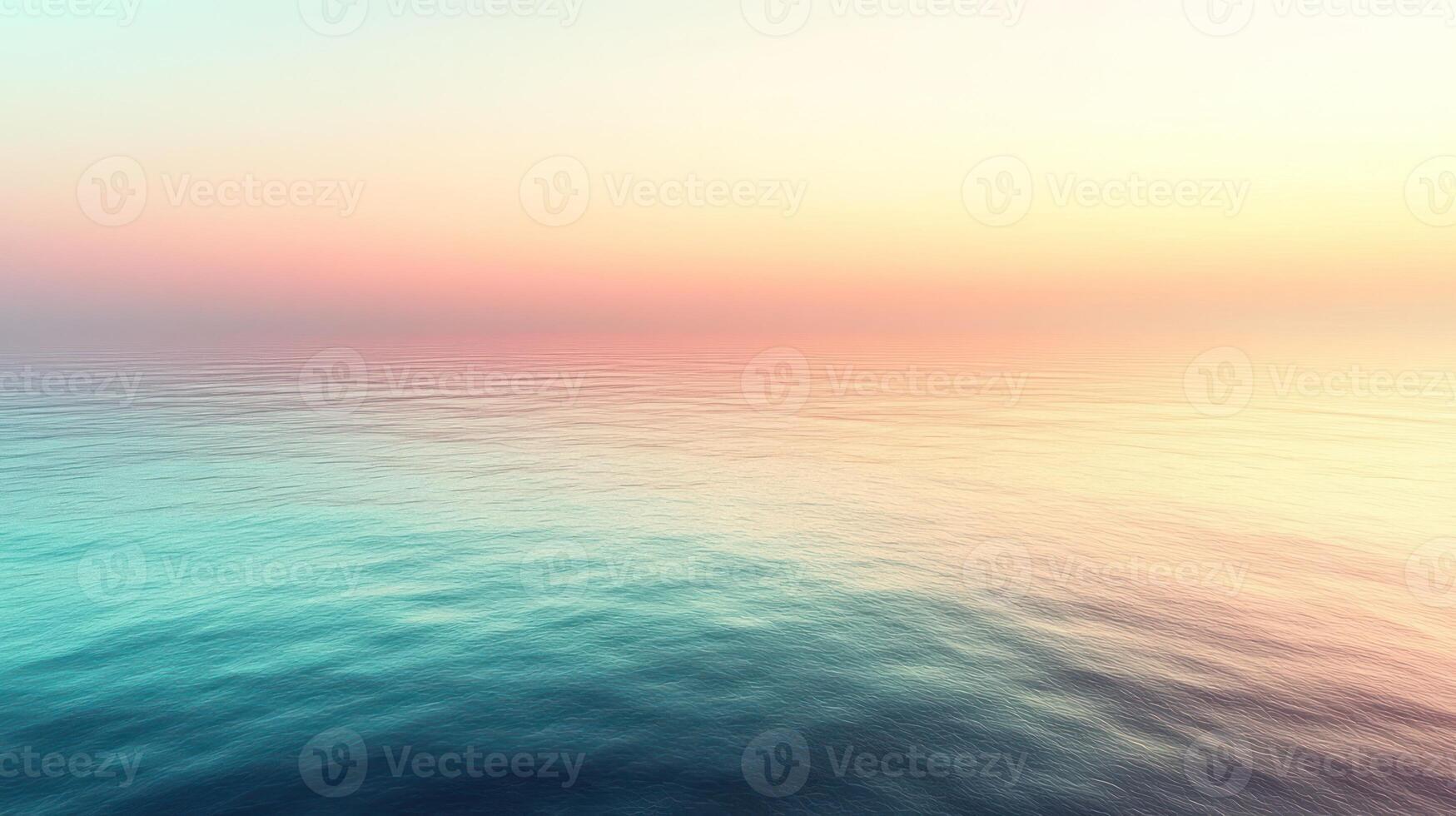 Gentle waves reflect the pastel hues of dawn in a tranquil ocean view photo