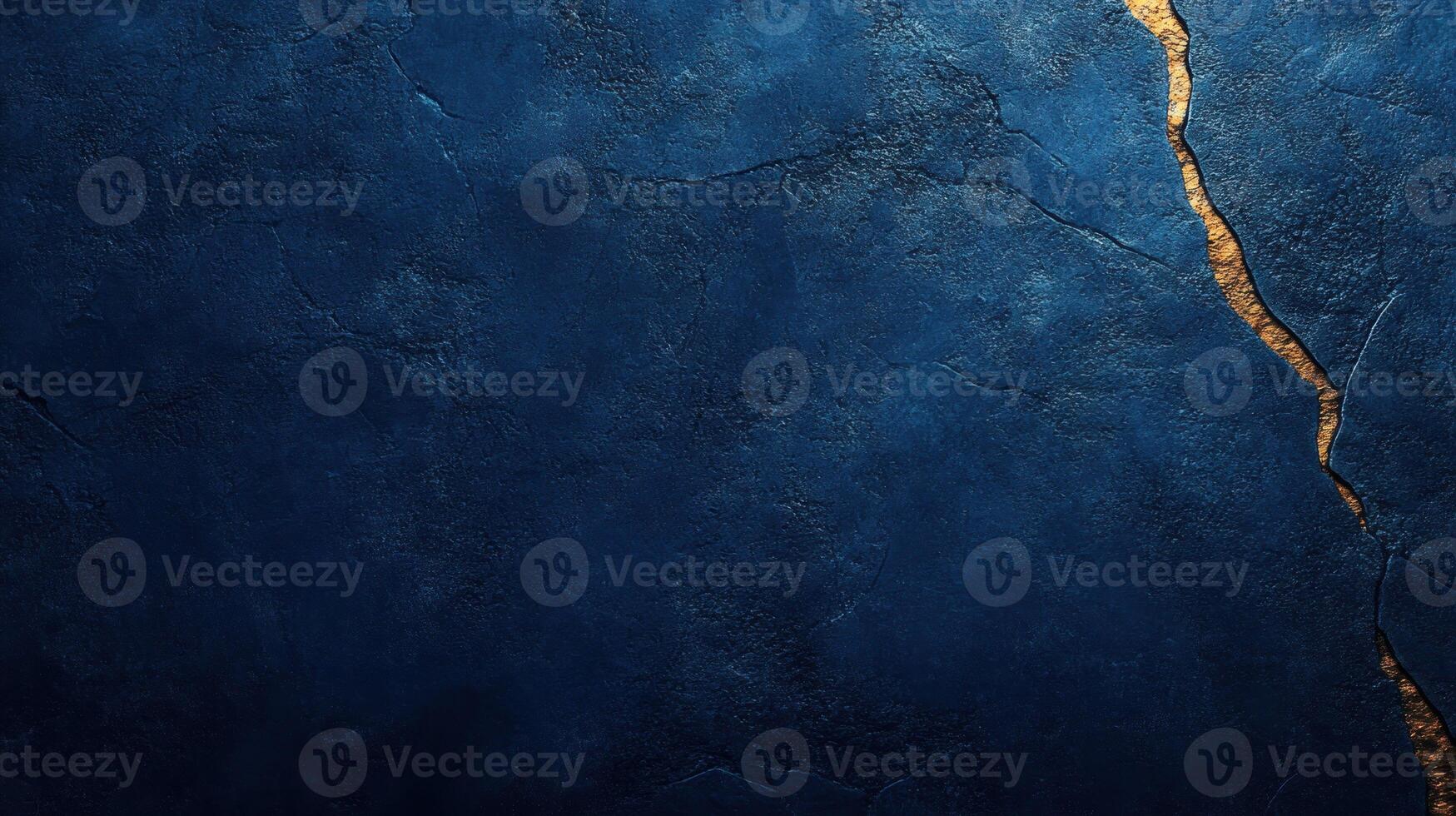 A dark blue surface features a prominent golden crack, showcasing a unique and artistic design photo