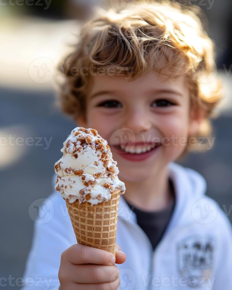 Happy child holds a delicious ice cream cone outdoors, showcasing excitement and joy on a sunny day photo