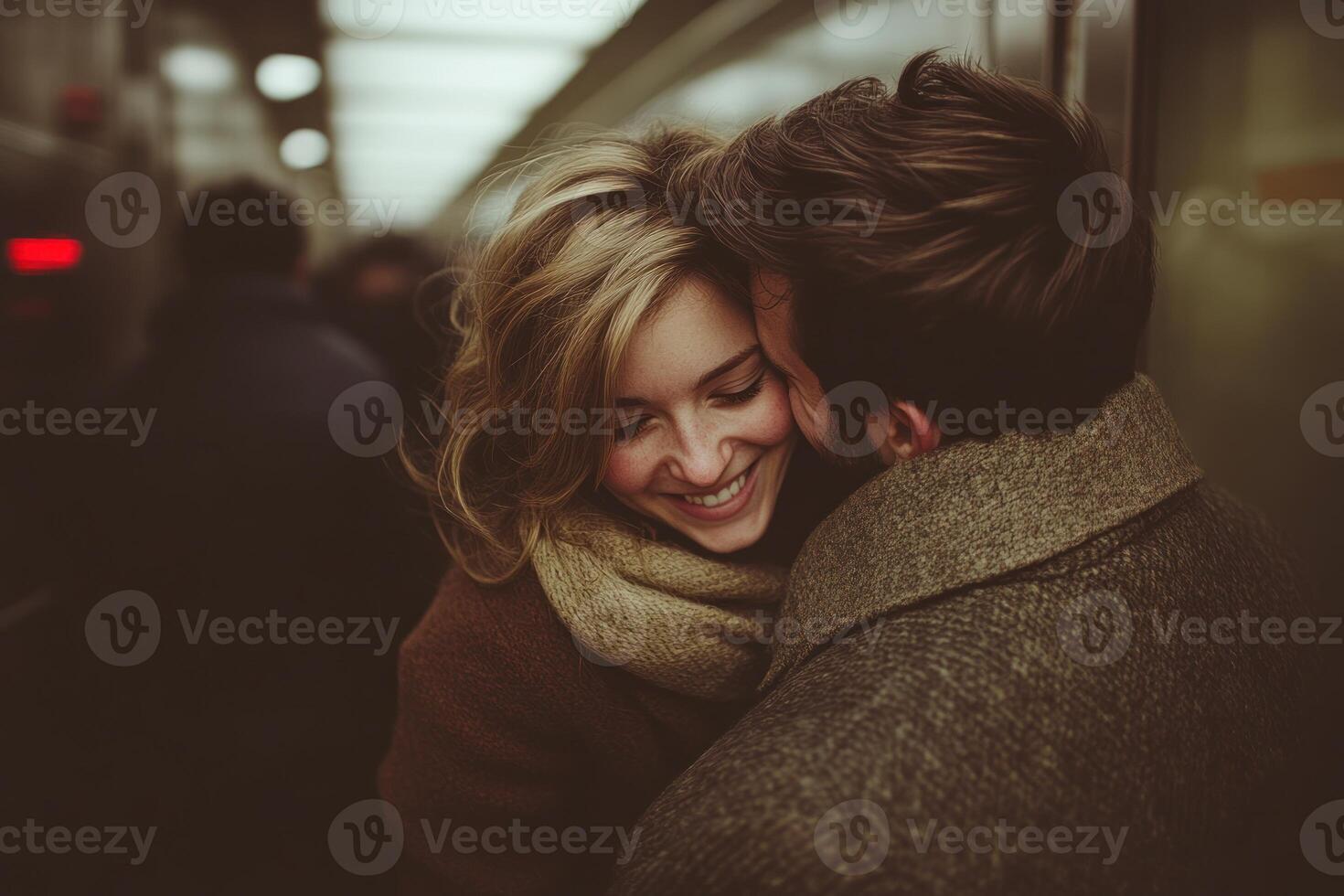 A couple shares a joyful moment in a subway car, exchanging smiles and warmth while others pass by photo