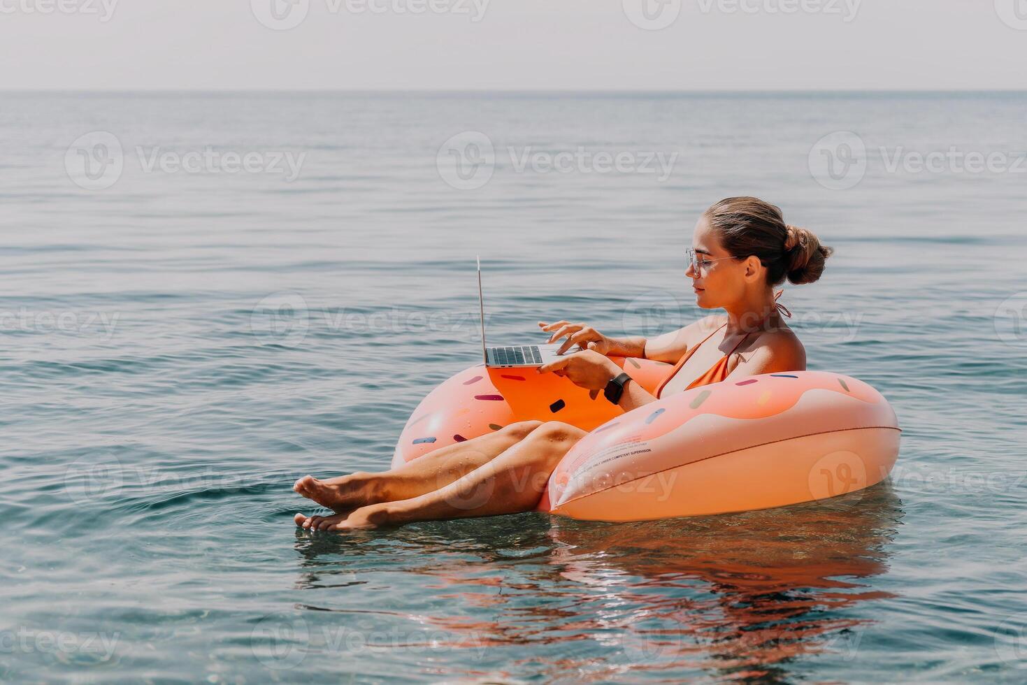 Woman, Float, Ocean. Relaxing on a Watermelon Float in the Ocean photo