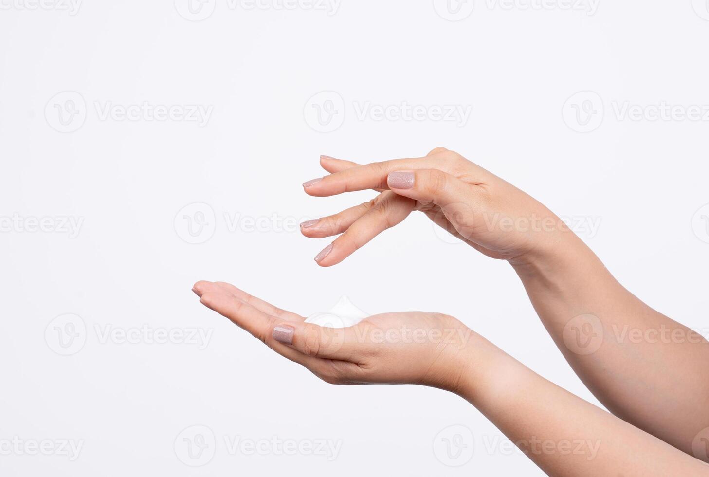 Woman applies a cosmetic cream to her hands. hand skin care concept photo