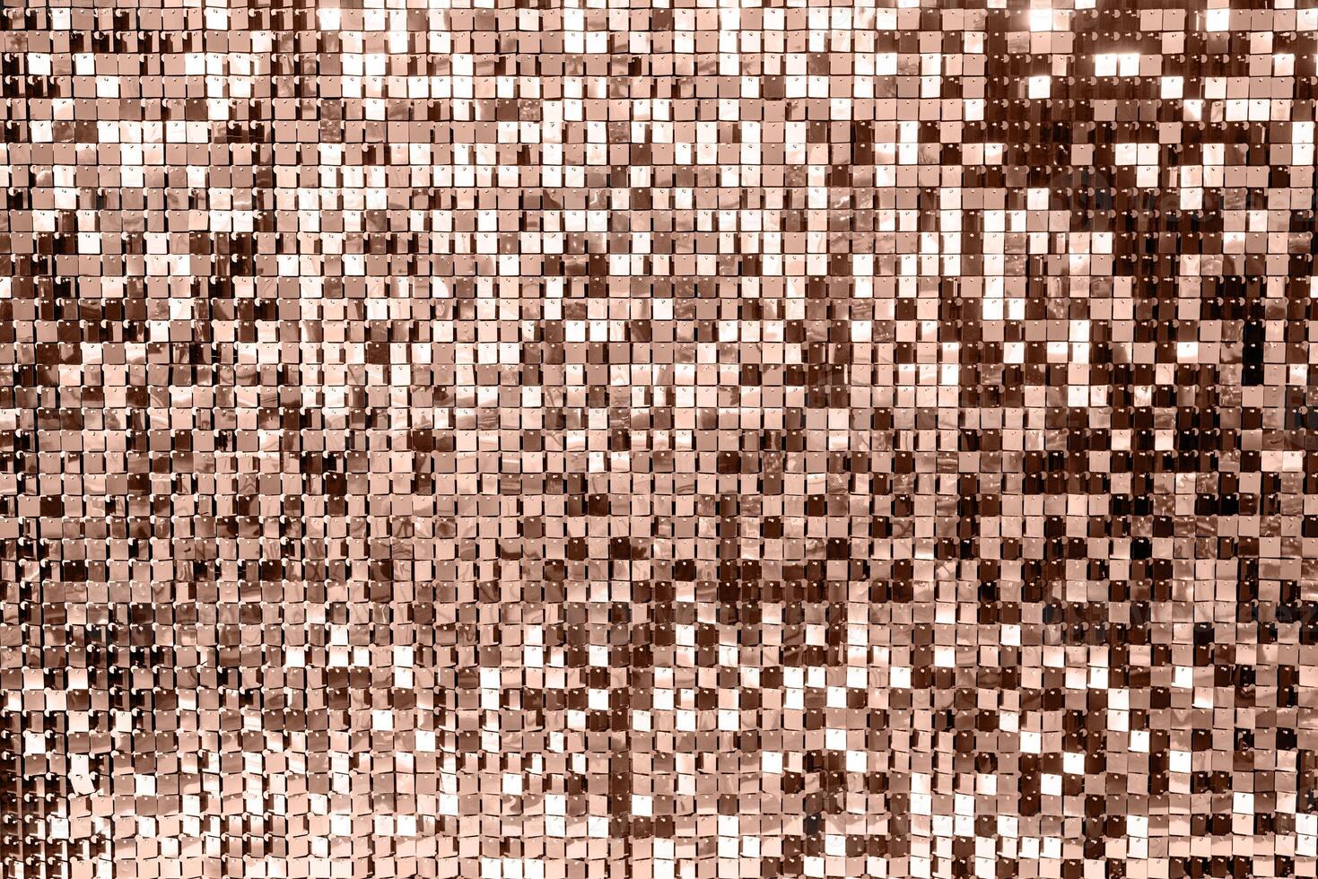 Mocha Mousse - color of the year 2025. metal shiny pieces making festive abstract texture photo