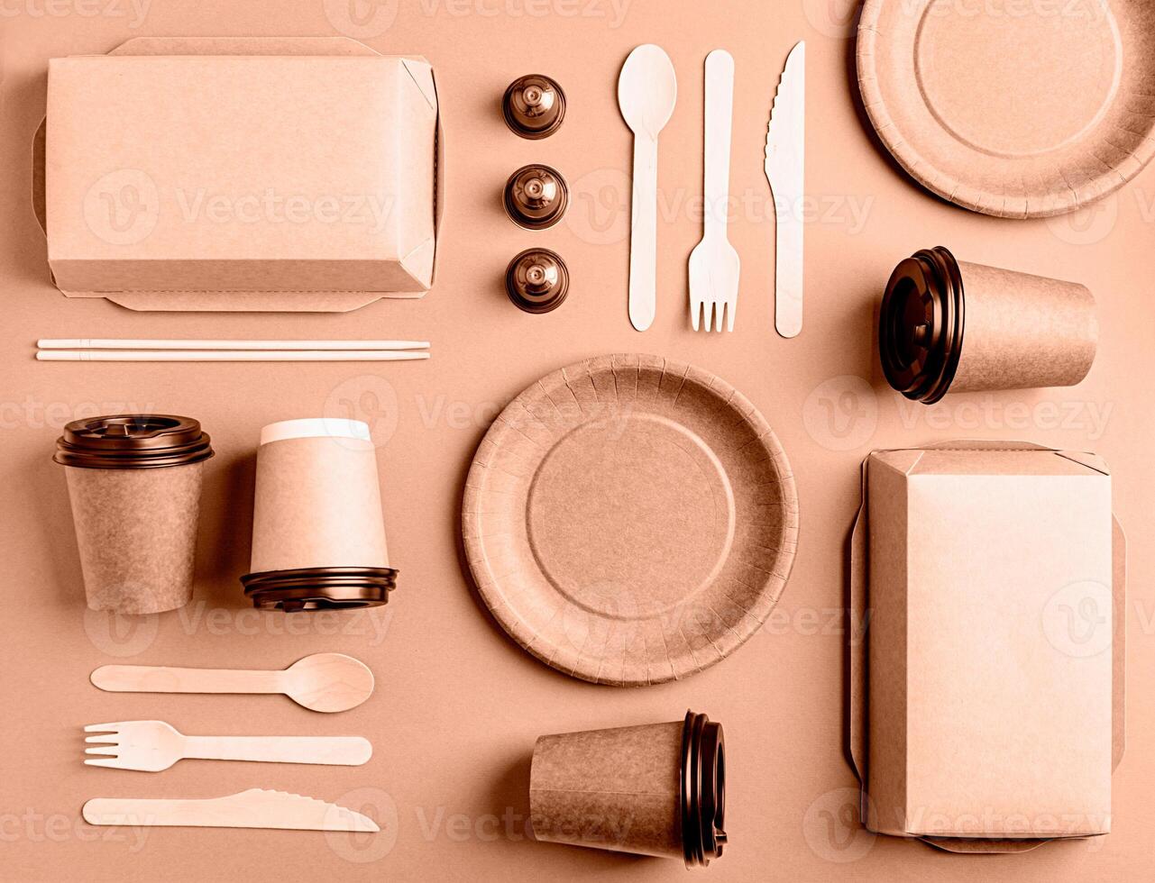 Mocha Mousse - color of the year 2025. Eco friendly disposable tableware on brown background photo