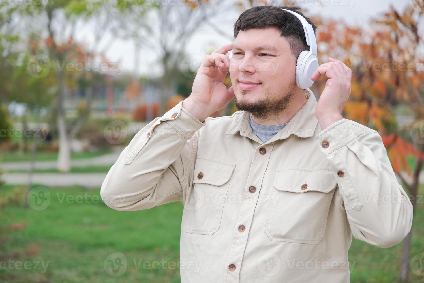 young man enjoying autumn days breathing fresh air photo