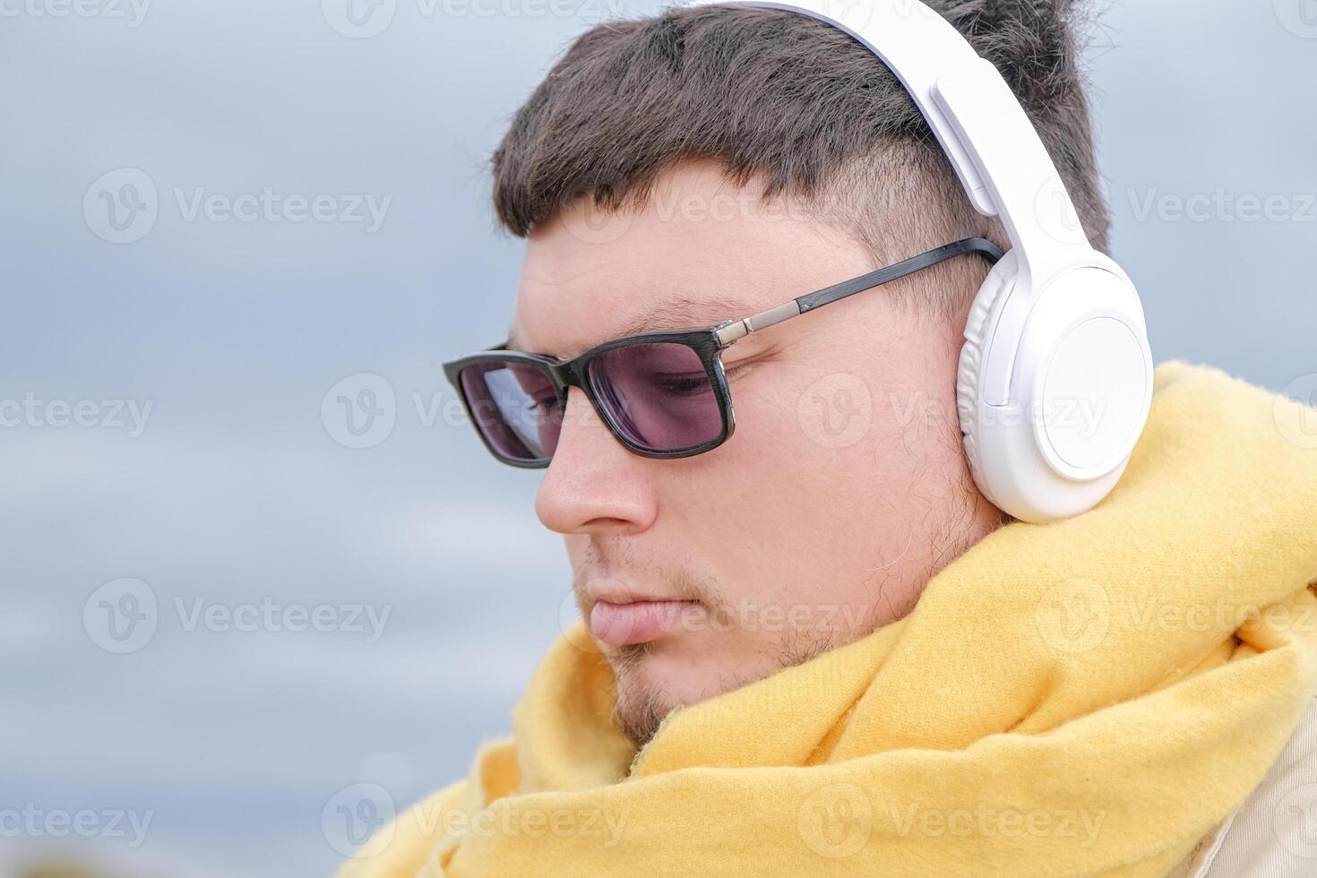 young man enjoying autumn days breathing fresh air photo