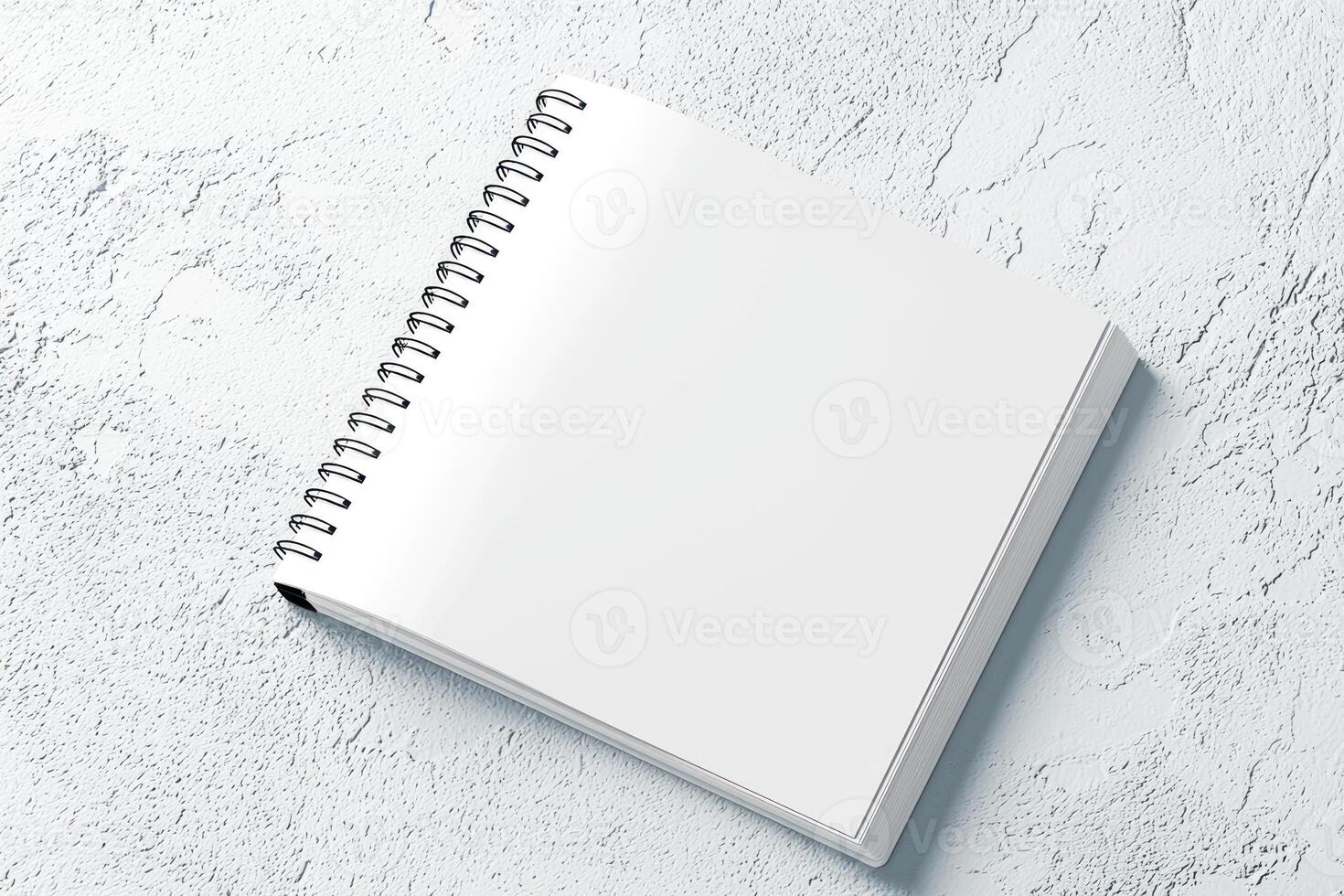 blank spiral notebook on textured surface, perfect for notes and sketches photo