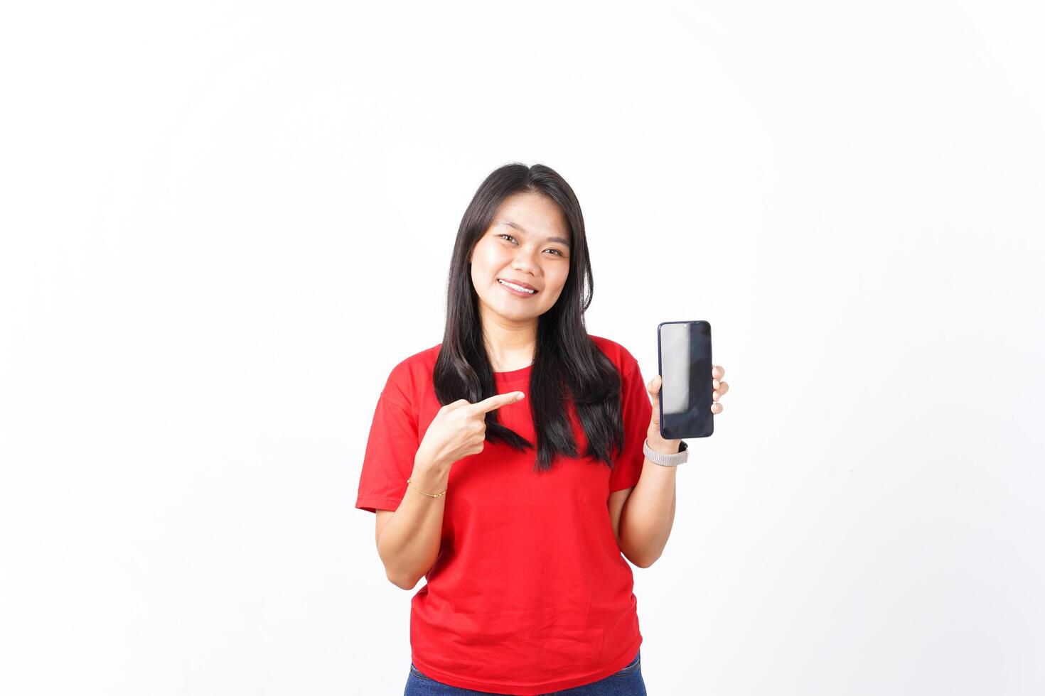 Showing Apps or Ads On Blank Screen Smartphone Of Beautiful Asian Woman wearing red shirt Isolated On White Background photo