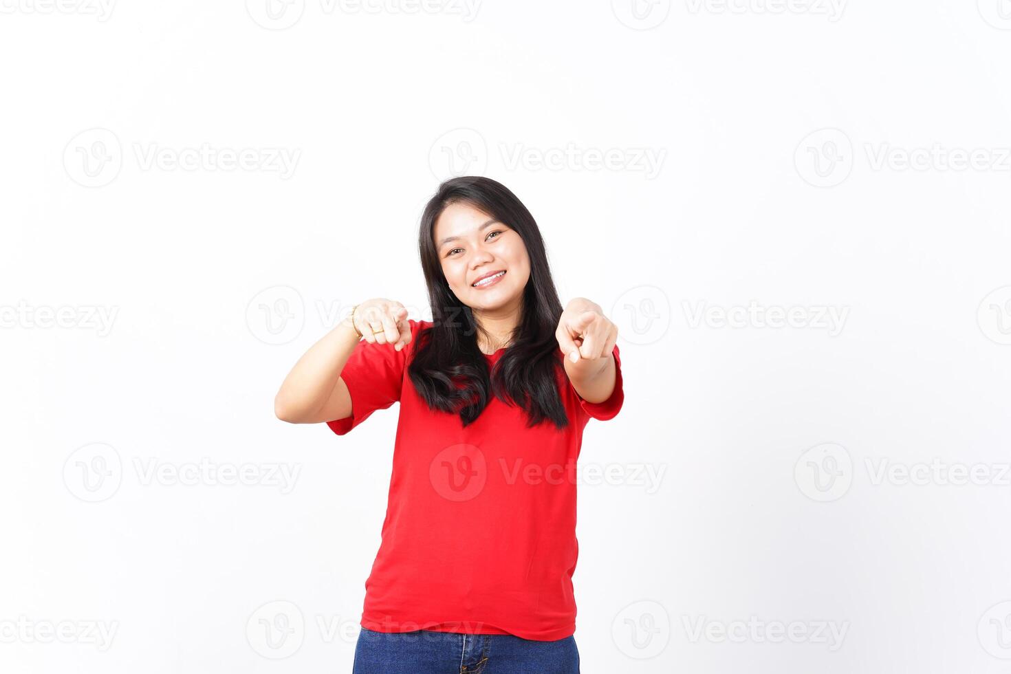 Smiling and Pointing at camera or you, want you gesture Of Beautiful Asian Woman wearing red shirt Isolated On White Background photo