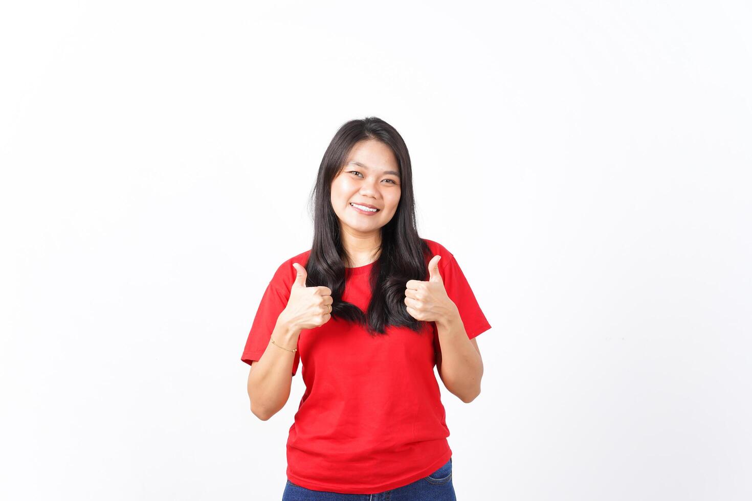 Smiling Looking at camera and showing thumbs up Of Beautiful Asian Woman wearing red shirt Isolated On White Background photo