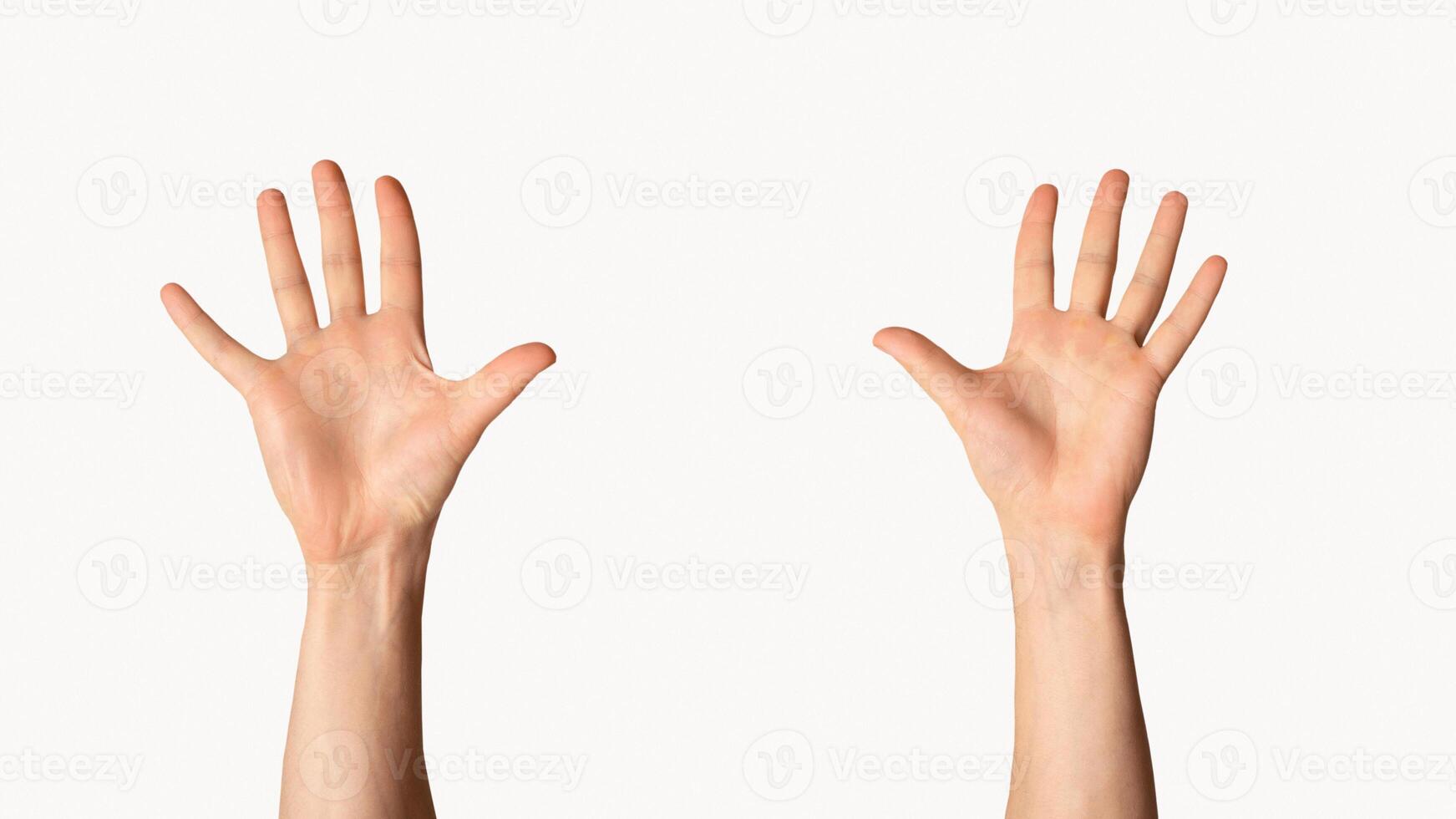 Millennial man raising both hands up on light background, close up view photo