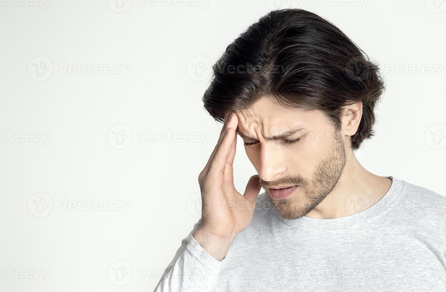 Sick man suffering from headache at home, panorama, free space photo