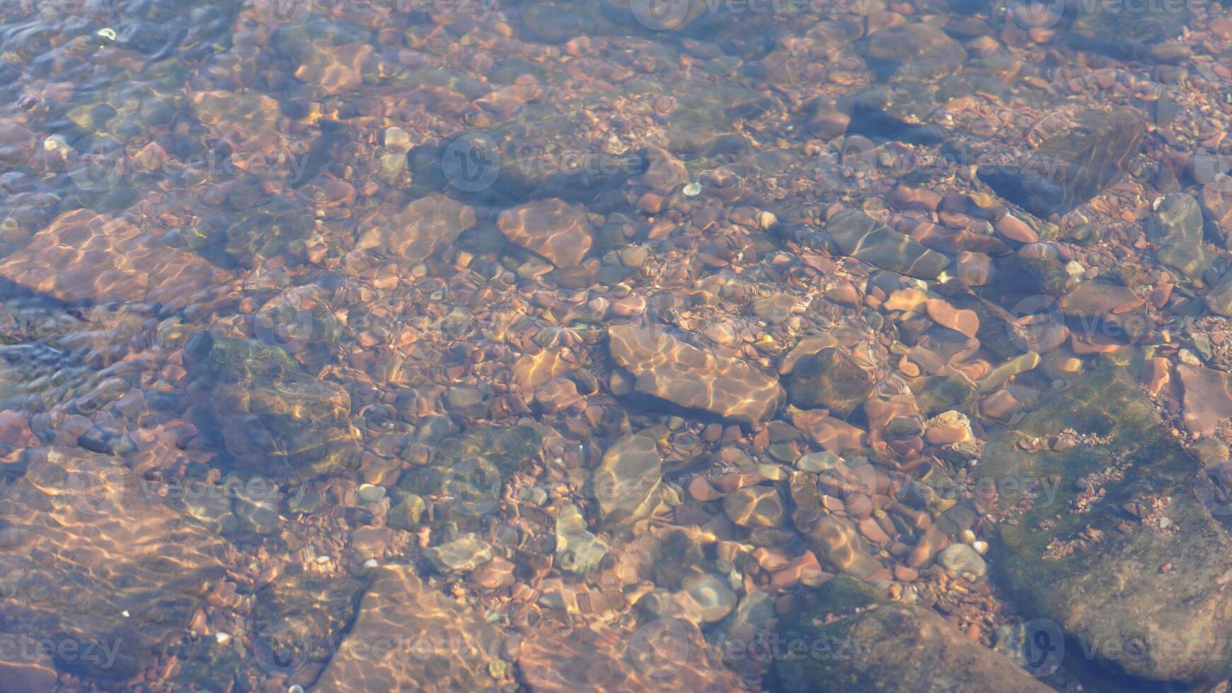 The clear water flow in the river photo