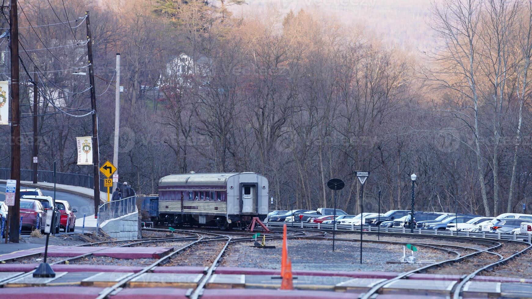 The railway station view with the wagons stopping on the iron tracks photo