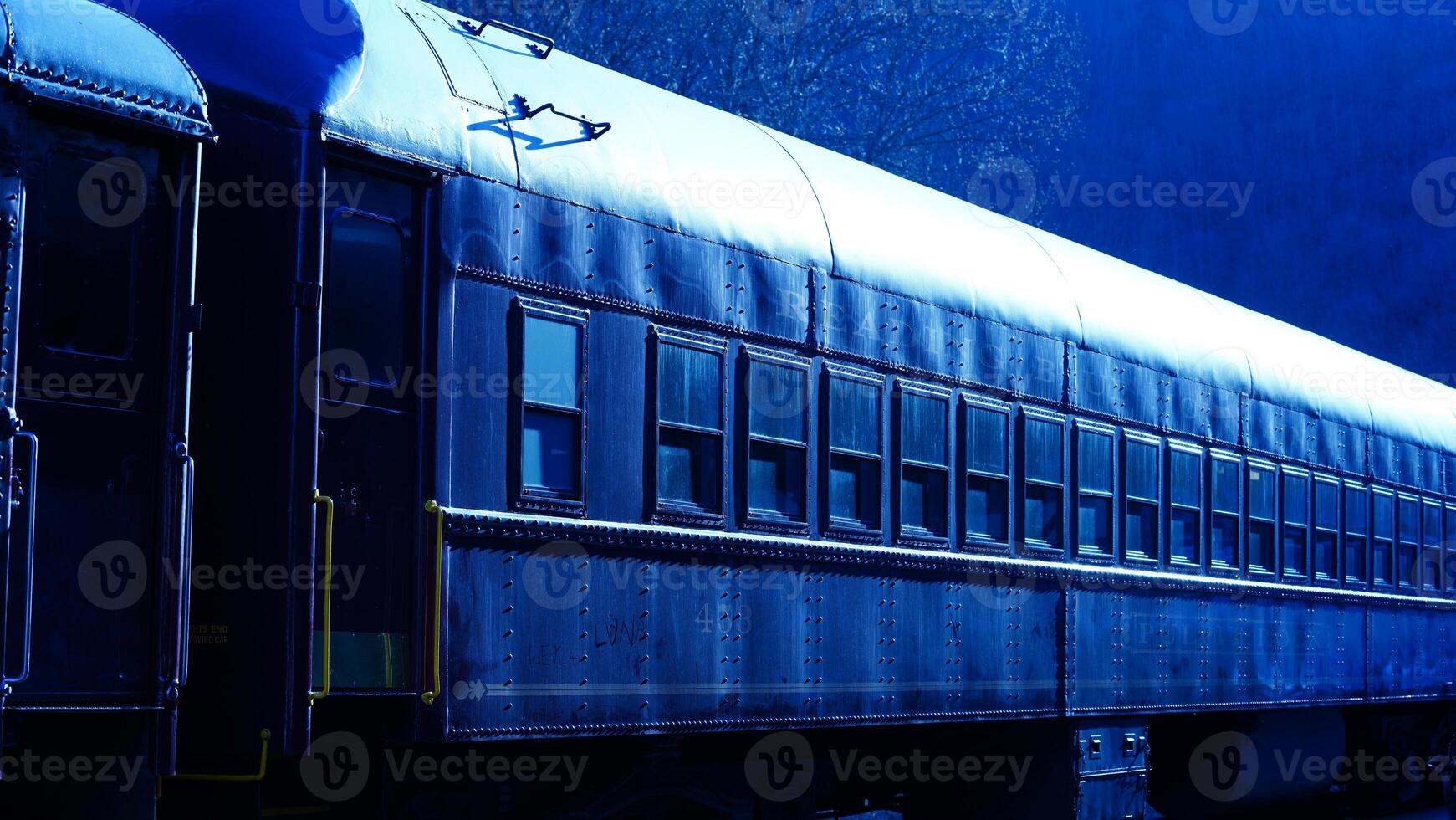 The railway station view with the wagons stopping on the iron tracks photo