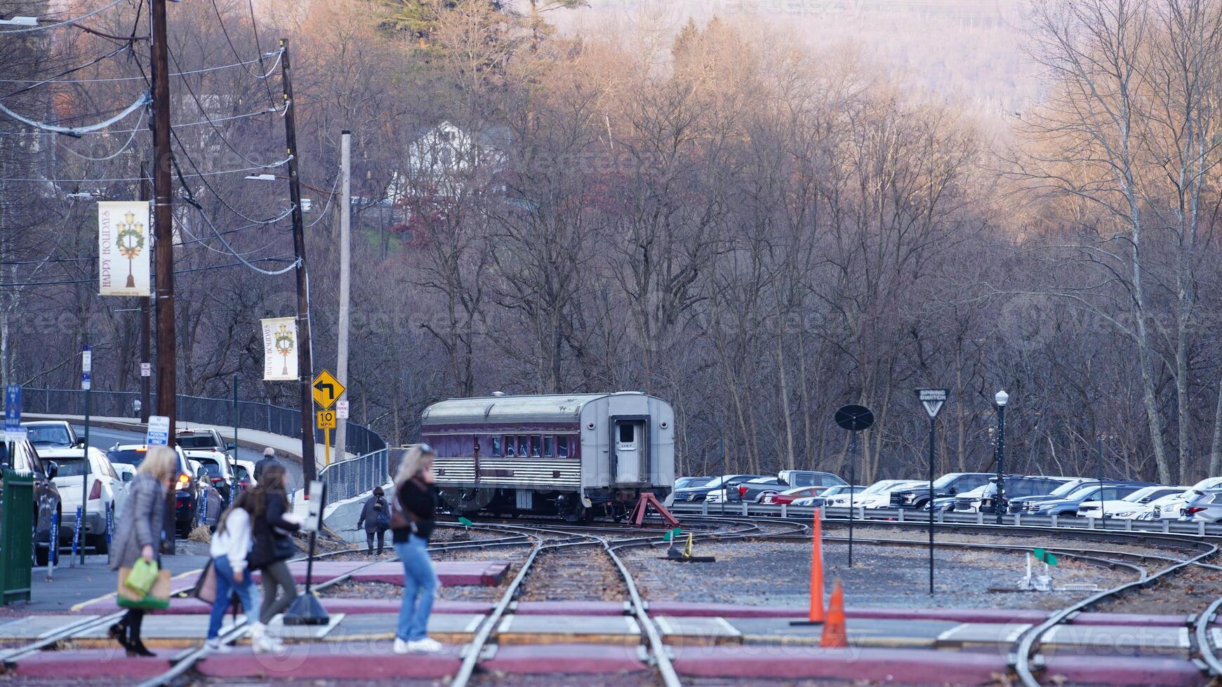 The railway station view with the wagons stopping on the iron tracks photo