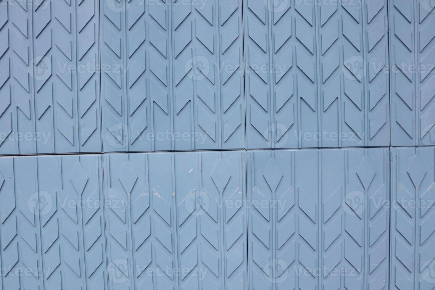 This is a Textured Blue Surface featuring an Arrow Pattern Design that captivates attention photo