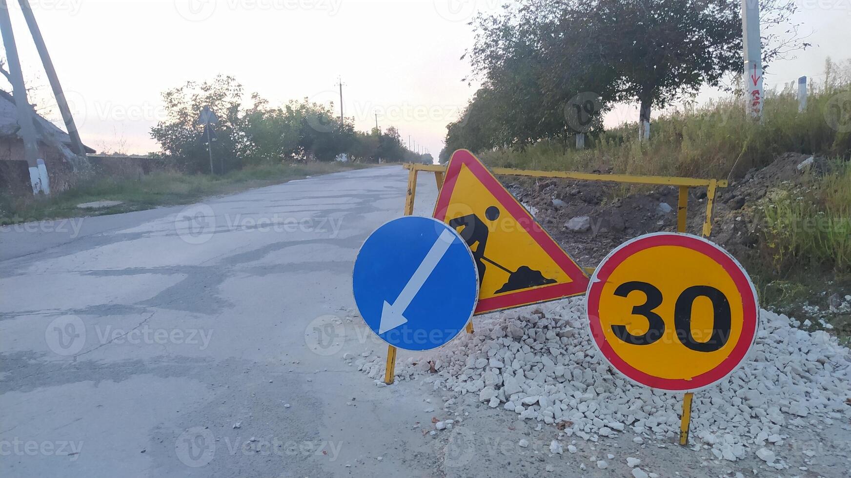 Road Construction Signs that Indicate Speed Limit Regulations and Directional Guidance for Drivers photo