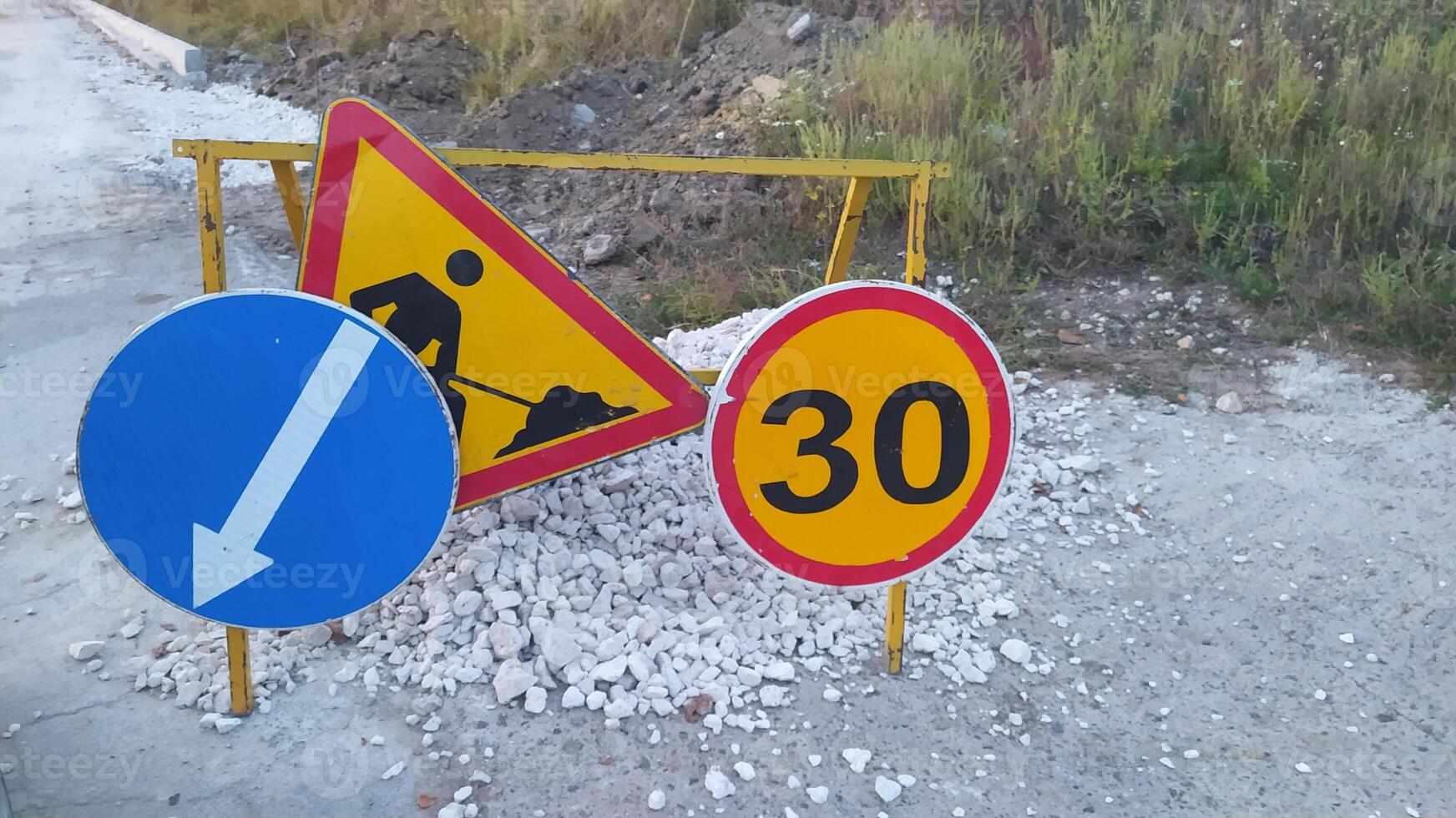 Road Construction Signs Featuring Crucial Speed Limits and Directional Guidance for Drivers photo