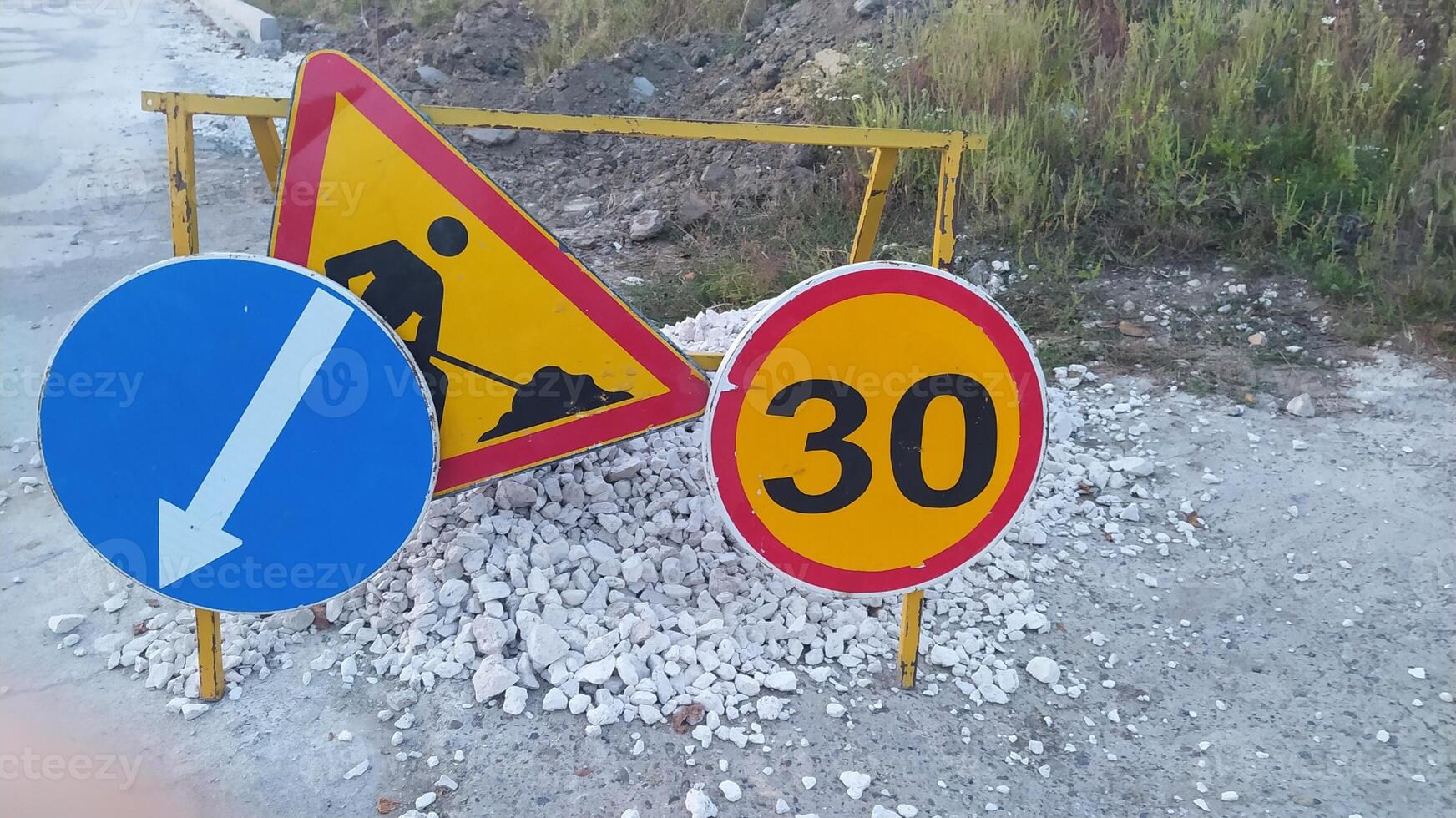 Be aware of Construction Warning Signs indicating the Speed Limit in the area ahead photo