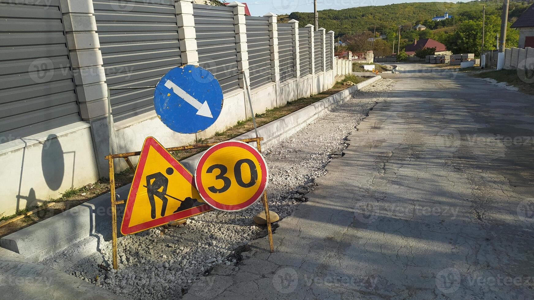 Be aware of the warning signs located on the under construction roadway for your safety photo
