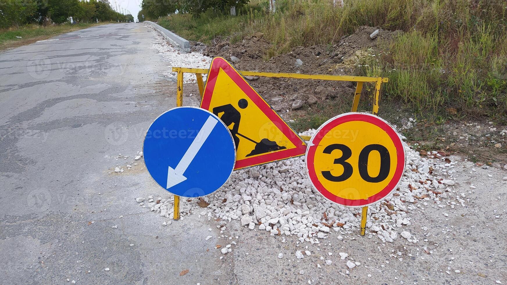 Attention Roadwork ahead. Please be cautious and follow the displayed speed limit signs photo