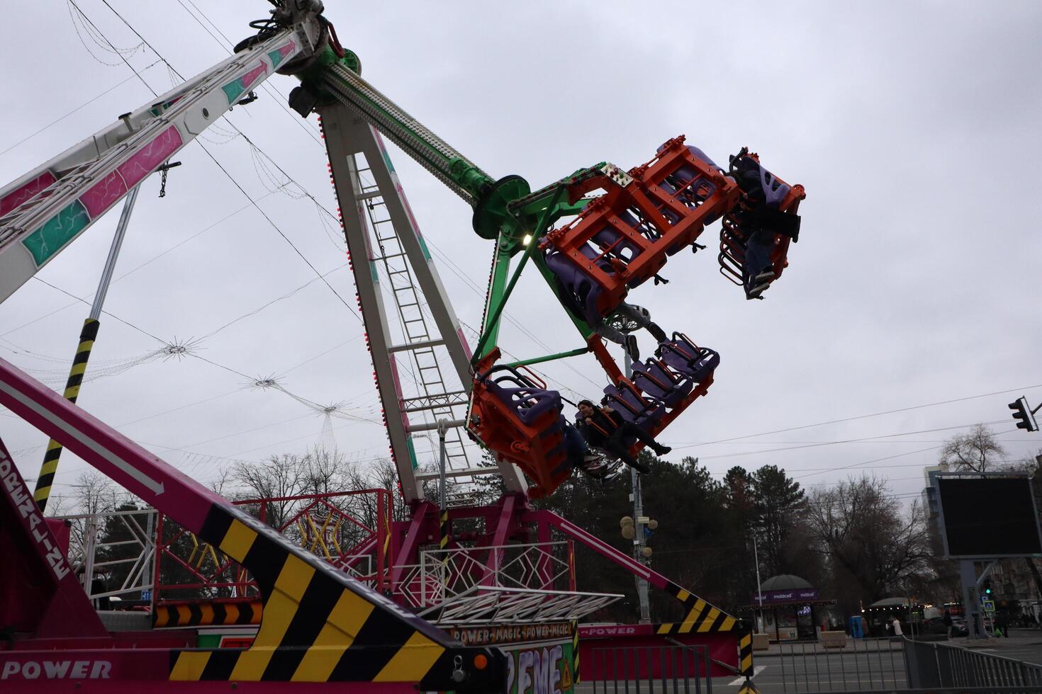 03.12.2024 Moldova Amazing and Thrilling Amusement Park Ride Captured in Exciting Action and Adventure photo