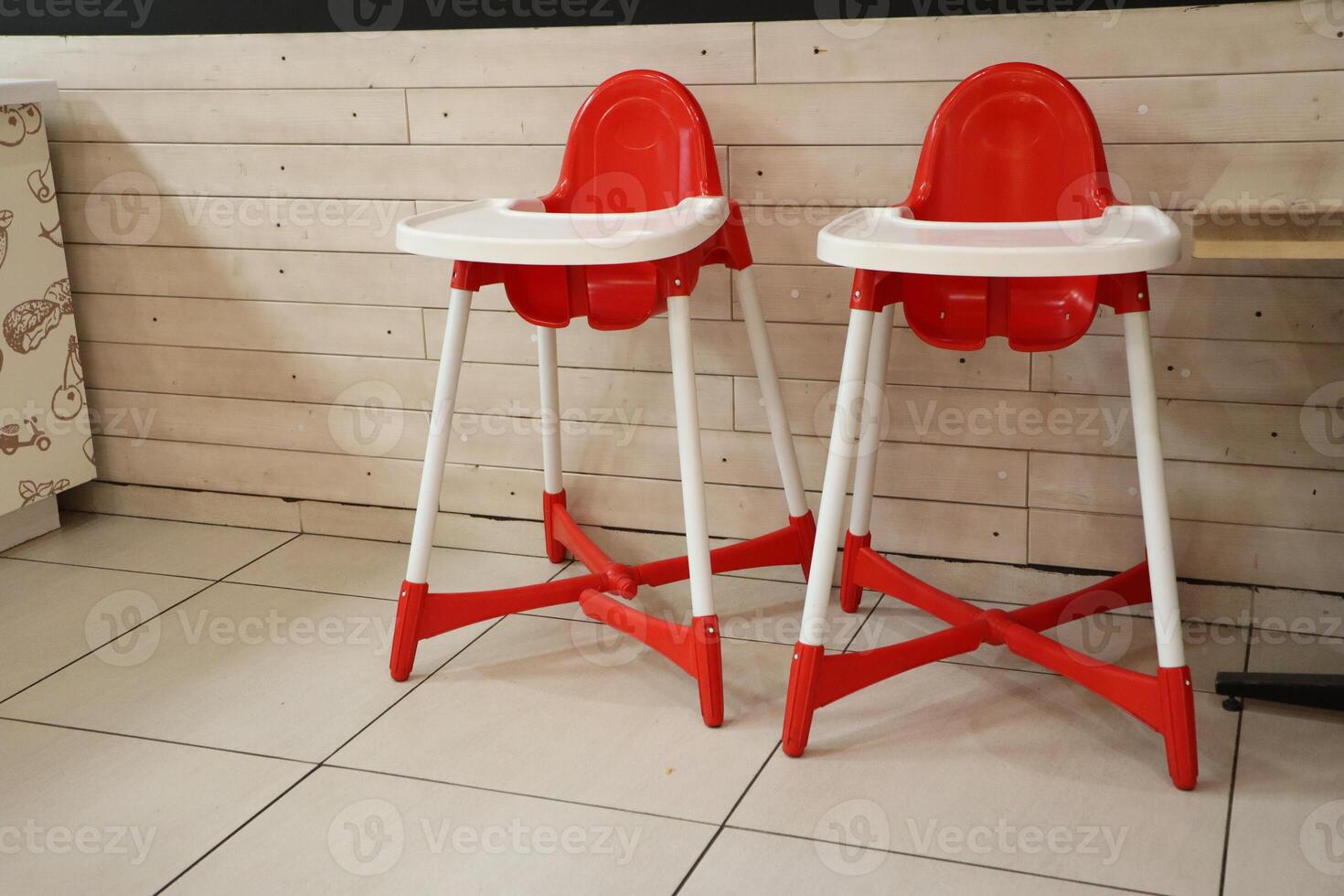 Stylish Bright Red High Chairs Designed Specifically for Kids in a Modern Dining Space photo