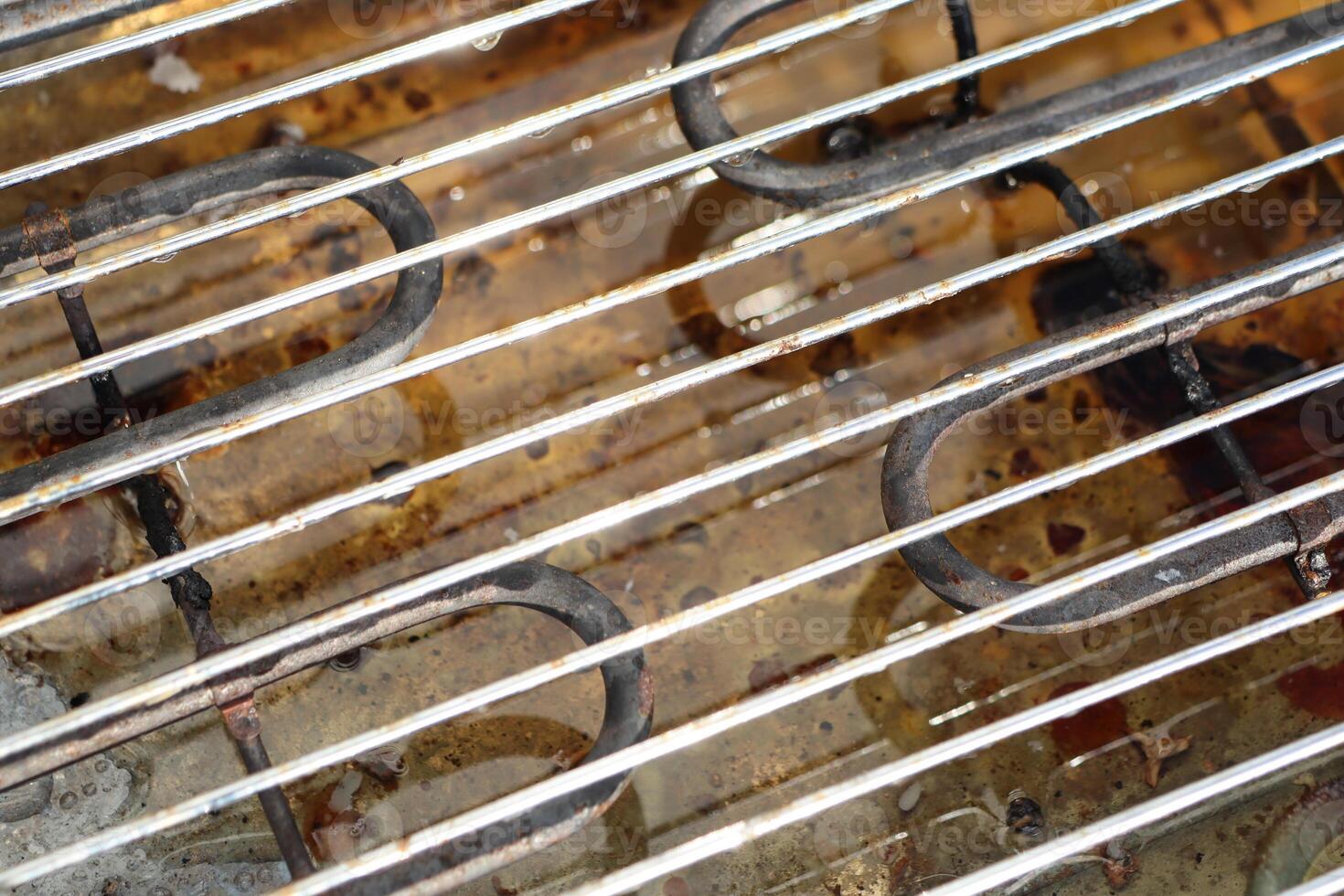 Detailed Closeup View of the Grill Grate along with the Heating Elements Nearby photo