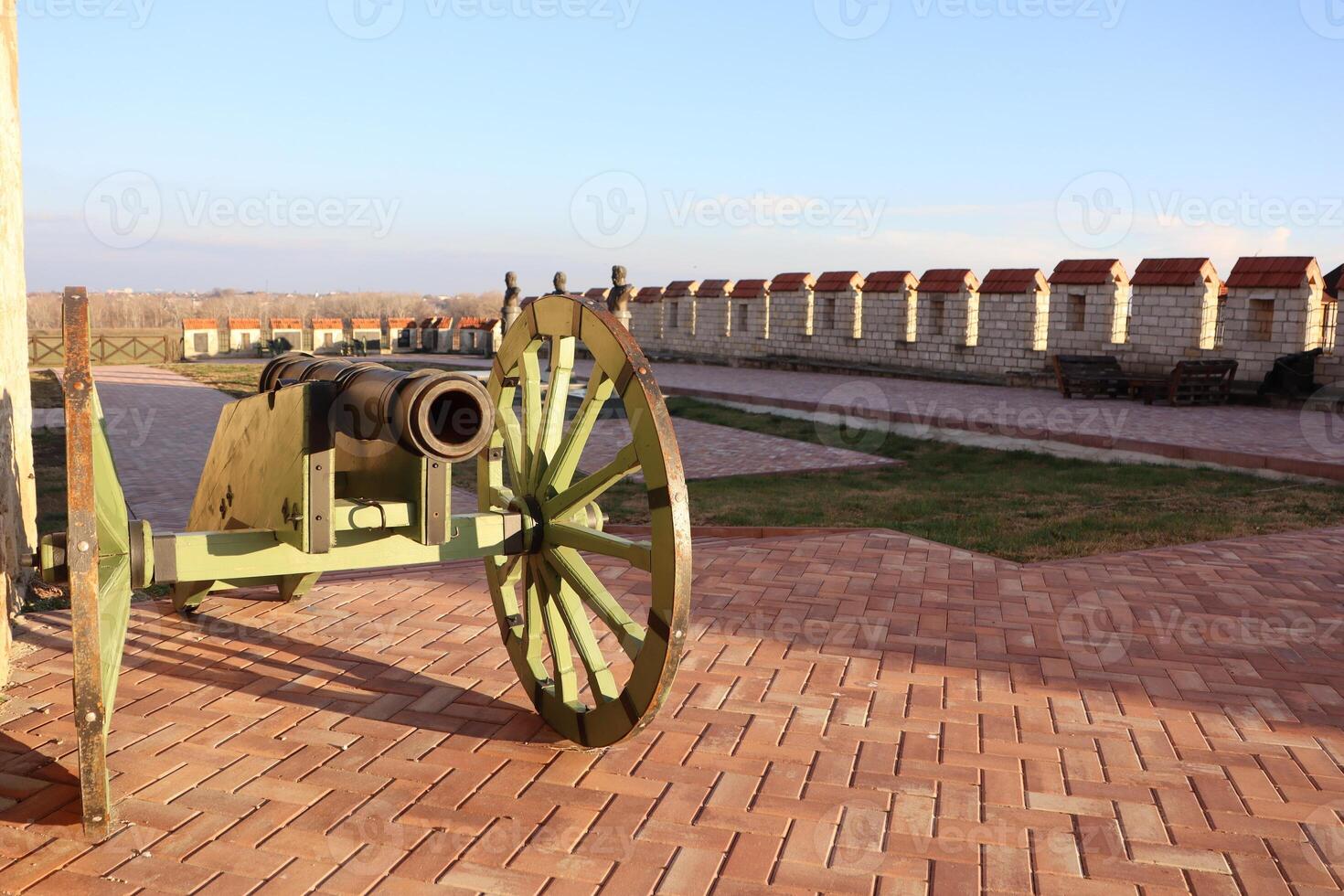 A Historic Cannon is on Display, Set Against a Scenic Outdoor Background and Setting photo