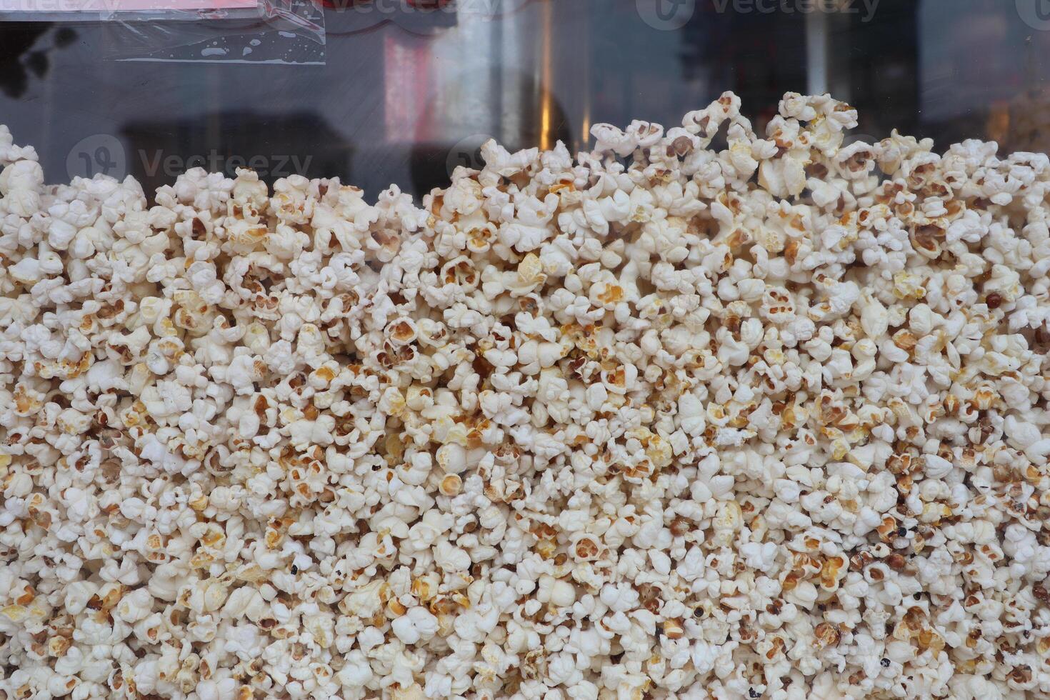 Experience the Delicious Popcorn Display at a Vibrant Snack Stand, Perfect for Everyone photo