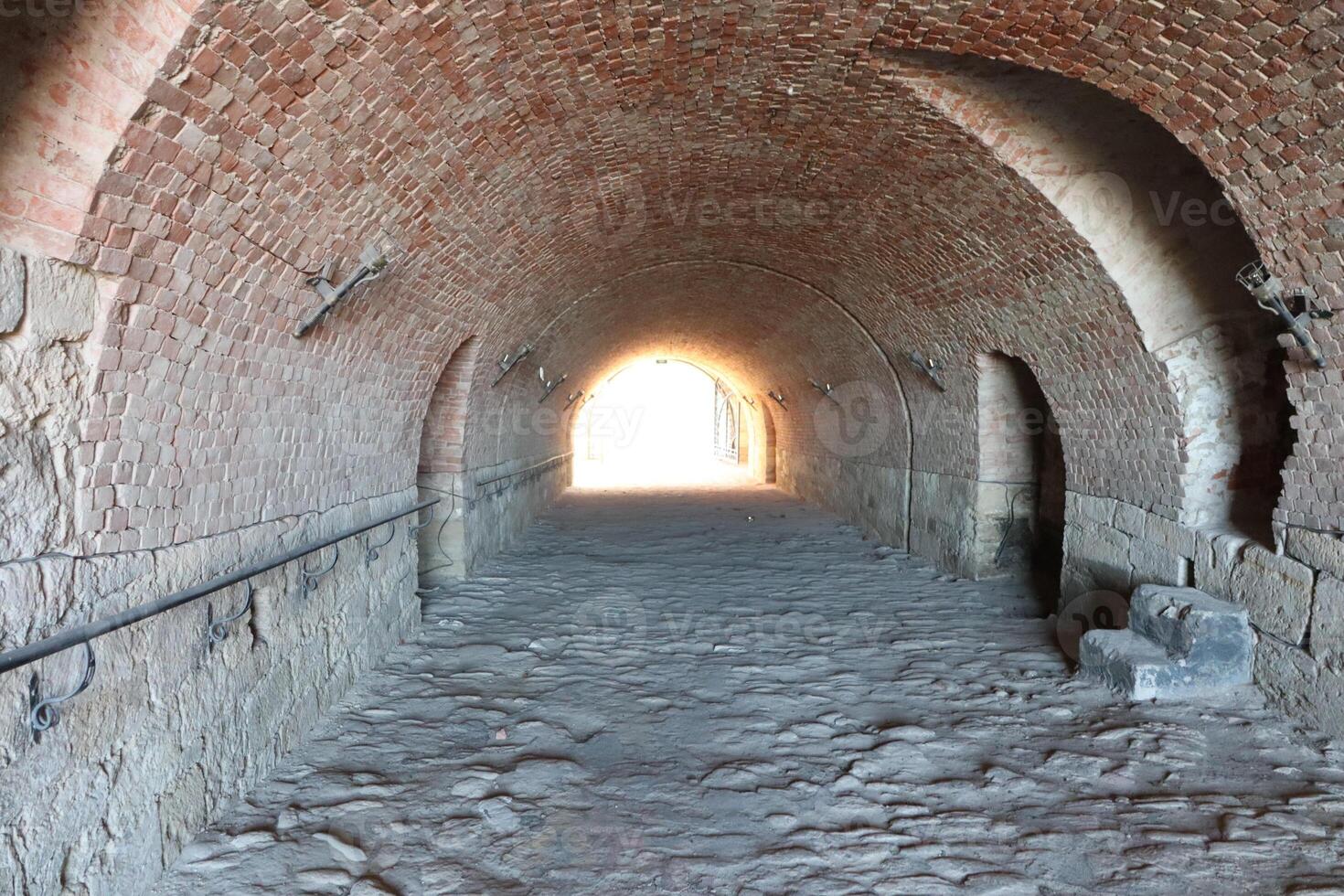 A Historic Brick Archway Leading to Light, inviting wanderers through a timeless journey photo