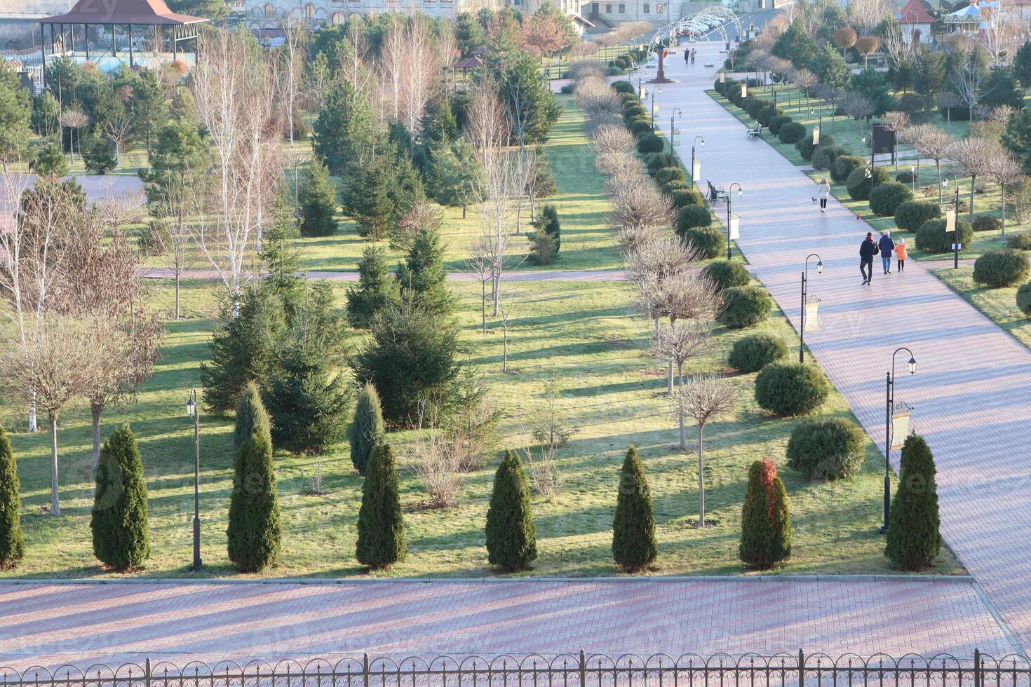A Beautiful Serene Park Landscape Featuring Scenic Pathways and Lush Greenery Throughout photo