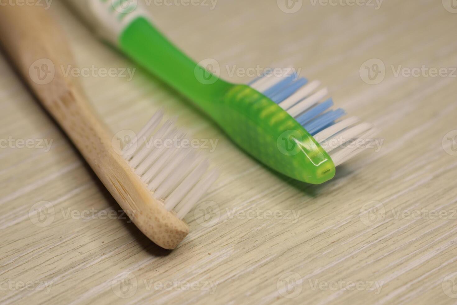 Aesthetic Display of Sustainable and Traditional Toothbrushes Arranged on a Wooden Surface photo