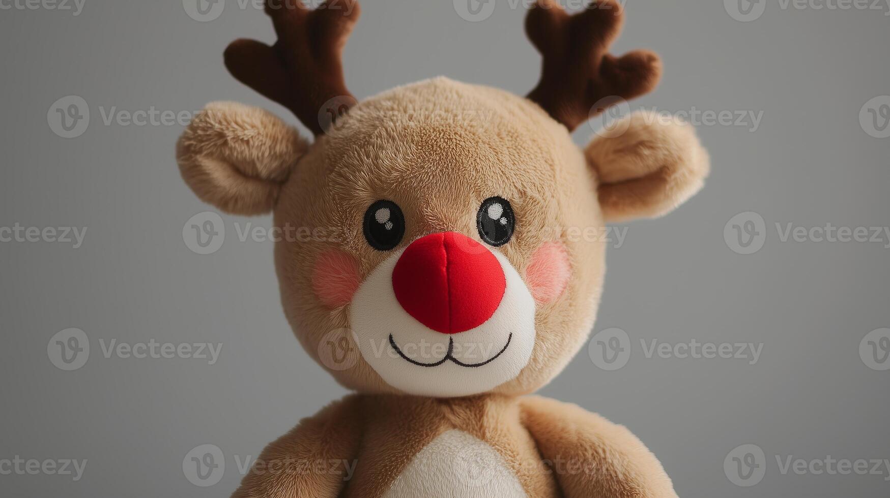 A stuffed reindeer with red nose and antlers photo