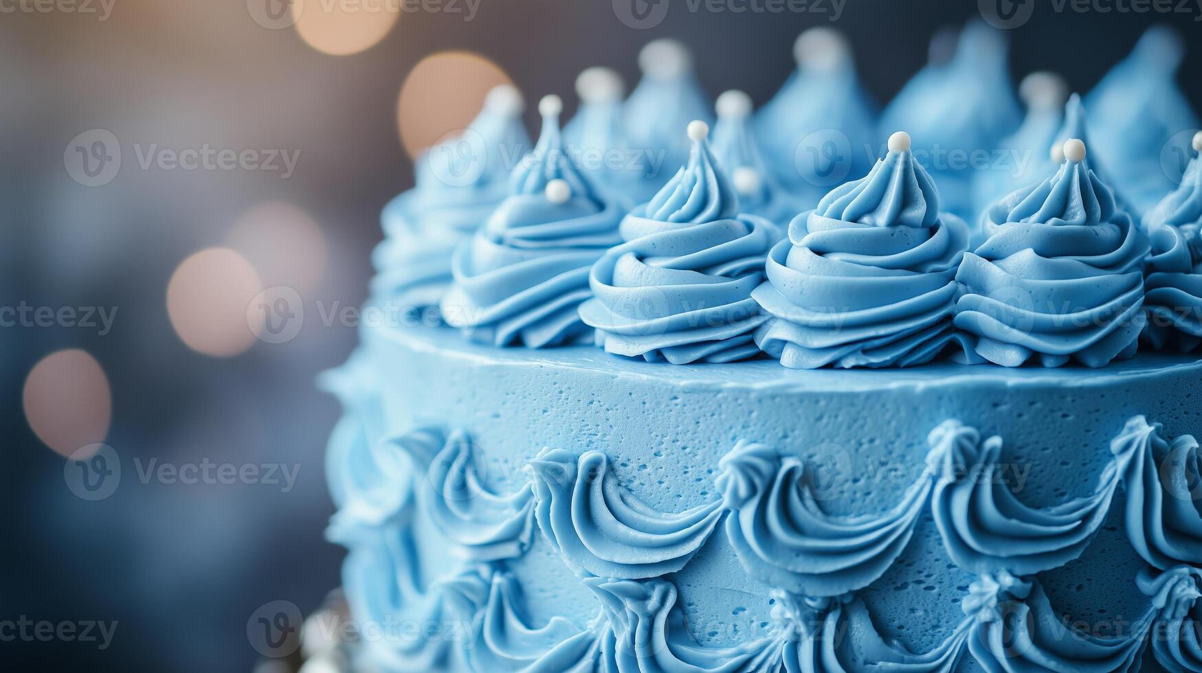 A close up view of a blue cake adorned with creamy frosting highlighting photo