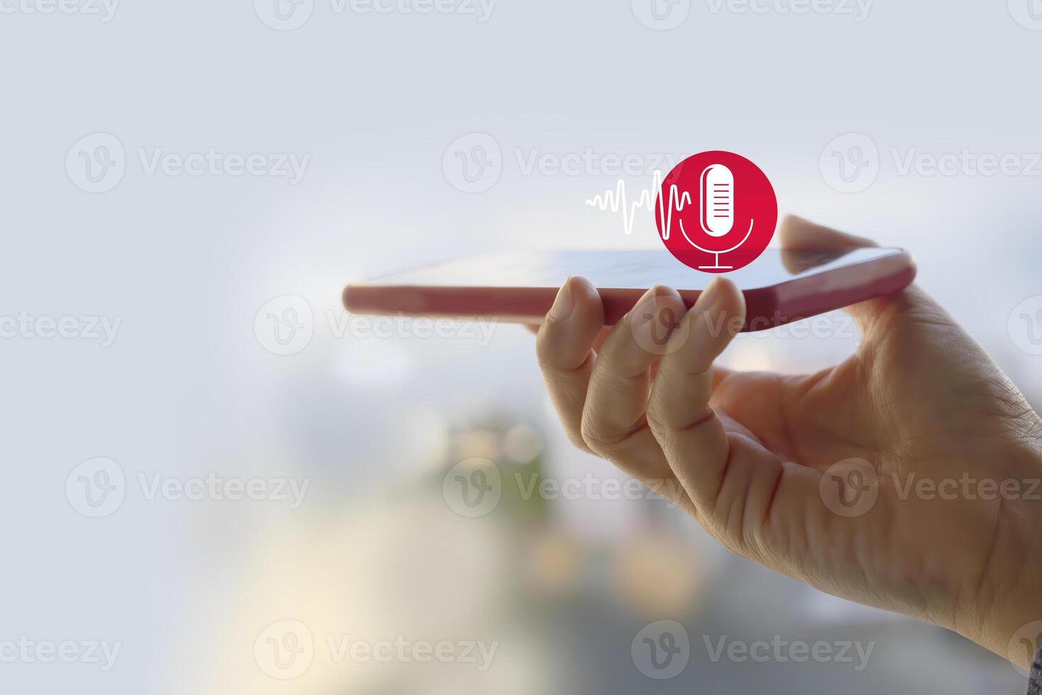 Voice recording. Hand holding microphone icon on smart phone. Mobile application Record sound, audio, music, voice message. or Use your voice to direct AI to search for information on Internet. photo