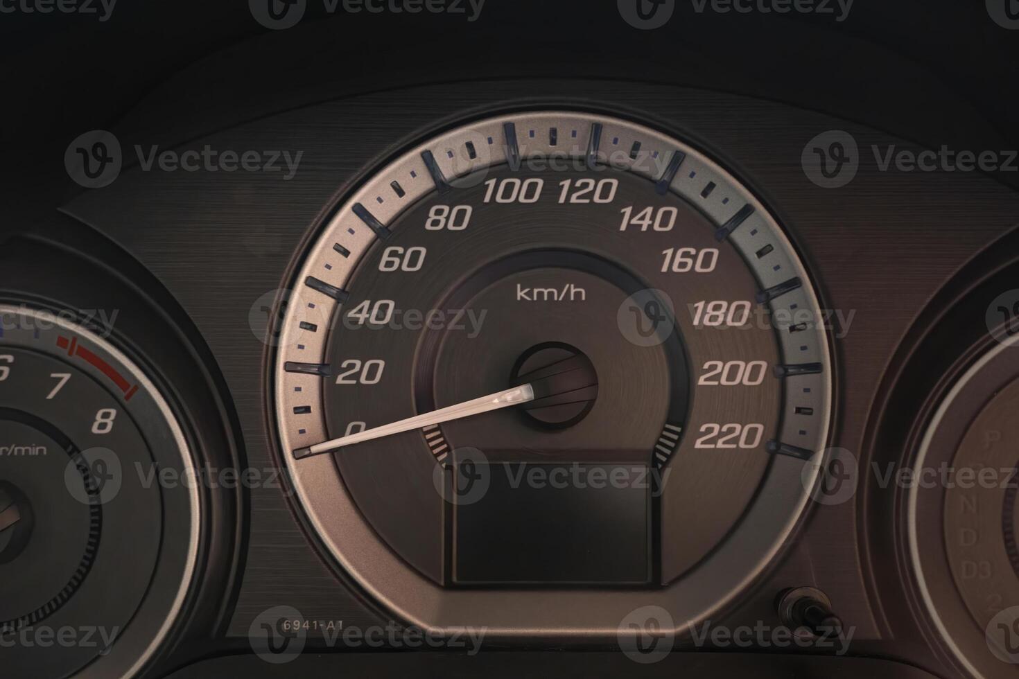 Close up of a dashboard with speedometer and gauges photo