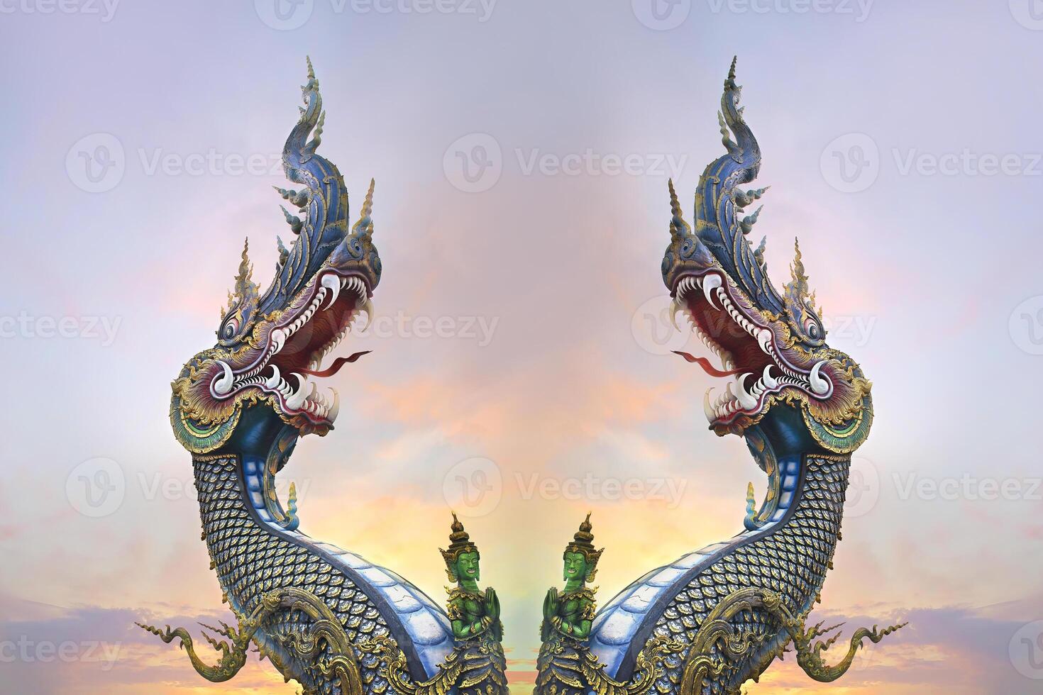 two dragon statues are in the sky photo