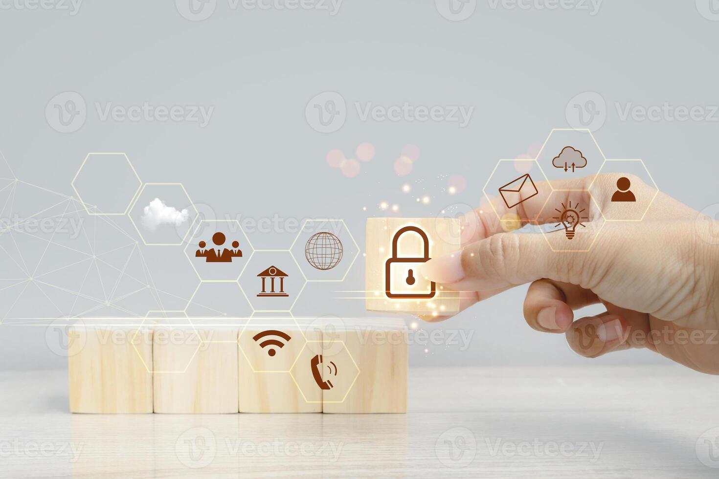 hand touching wooden blocks with icons on them photo