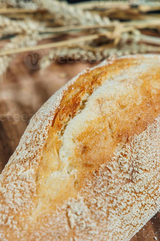 Freshly baked rye bread on yeast-free sourdough and whole grain, rye and wheat flour. It lies on a cut board. photo