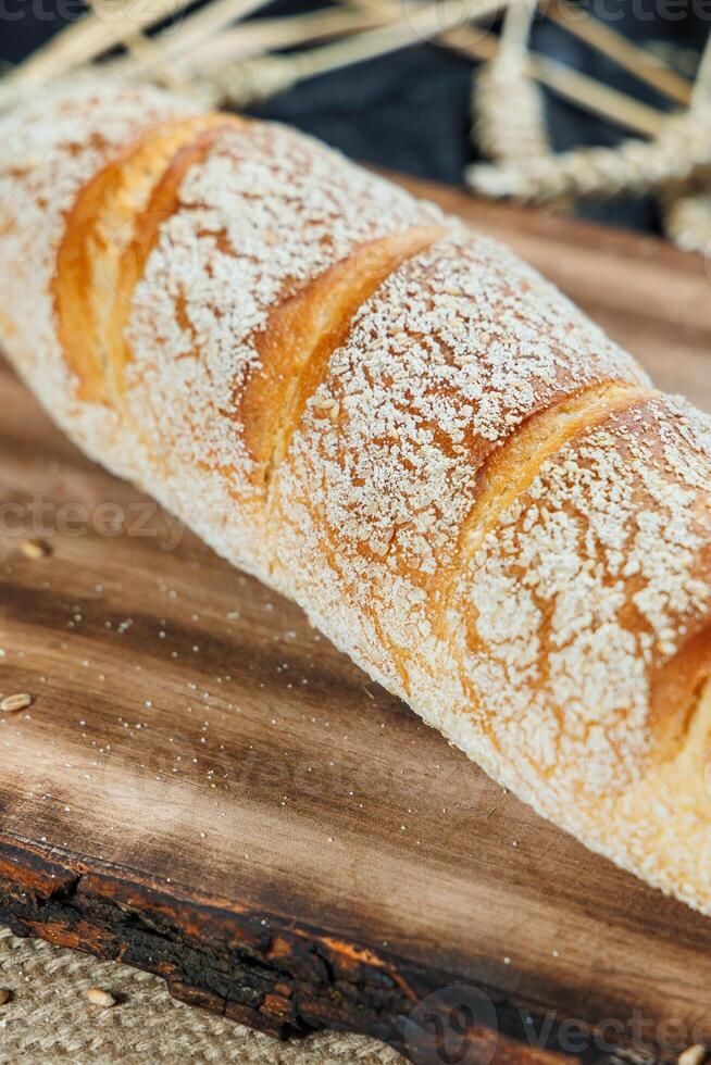 Freshly baked rye bread on a mixture of whole grain, rye and wheat flour. Fresh homemade bread. Craft pastries photo