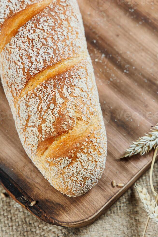 Freshly baked rye bread on a mixture of whole grain, rye and wheat flour. Fresh homemade bread. Craft pastries photo