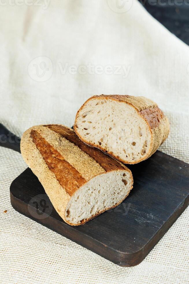 Freshly baked rye bread on a mixture of whole grain, rye and wheat flour. Fresh homemade bread. Craft pastries photo