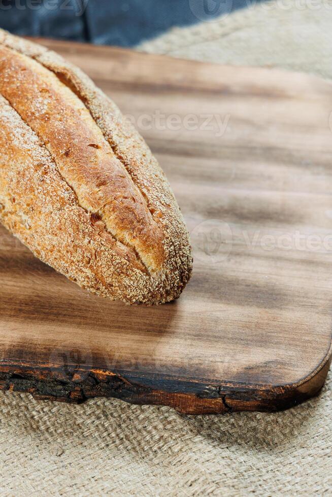 Freshly baked rye bread on a mixture of whole grain, rye and wheat flour. Fresh homemade bread. Craft pastries photo